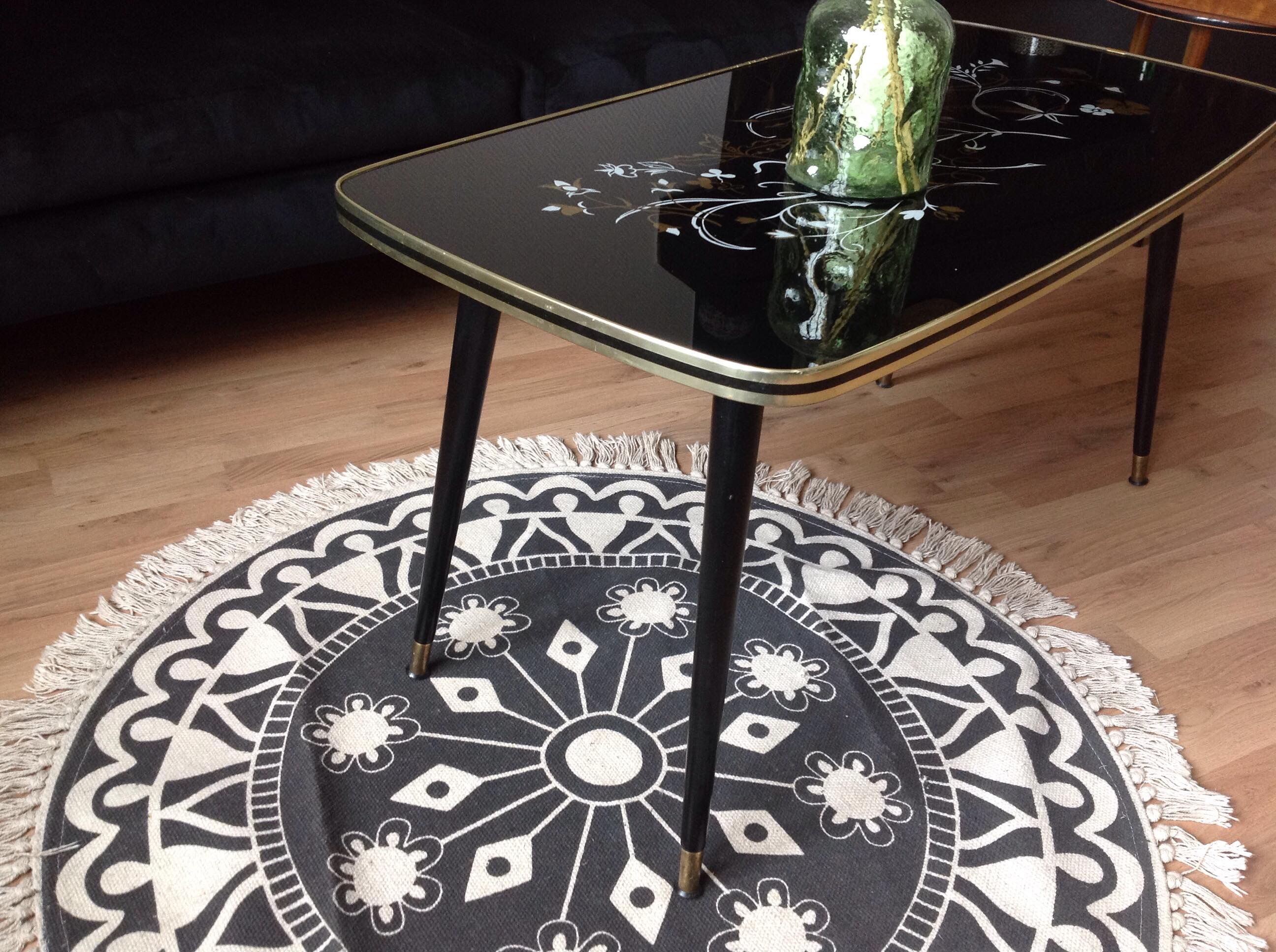 Coffee table, year 60, black with floral patterns