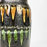 "Fat Lava" vase black background and colorful enamelled drippings