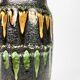 "Fat Lava" vase black background and colorful enamelled drippings