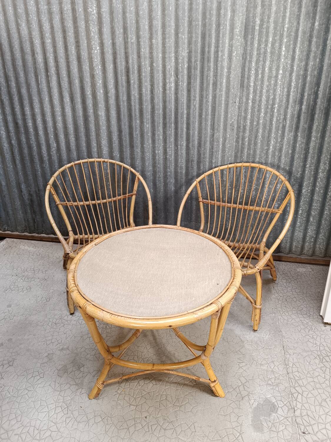 Vintage rattan wicker garden furniture set with 2 shell armchairs and a bar table
