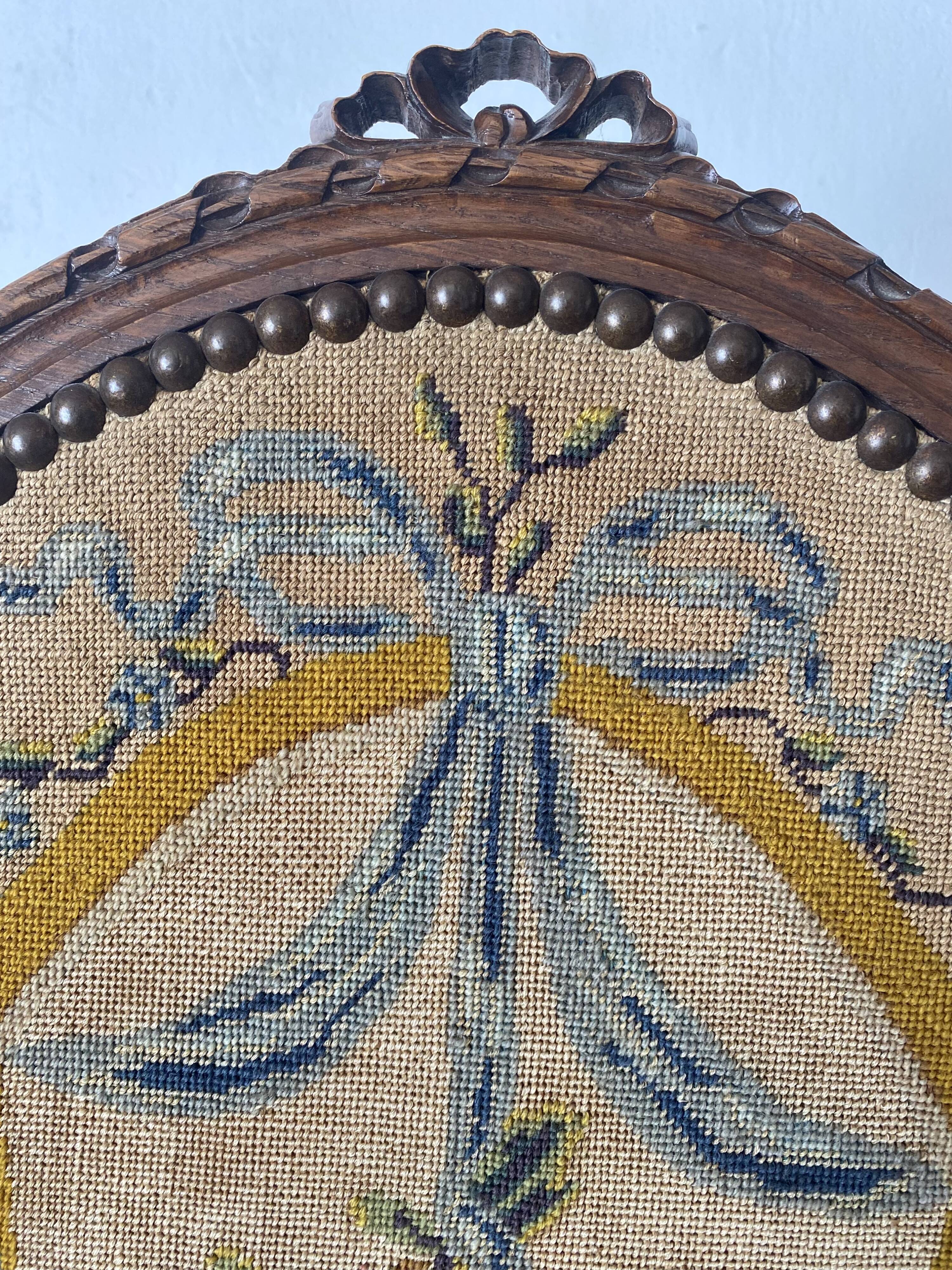 Wooden and embroidered fabric fireplace screen