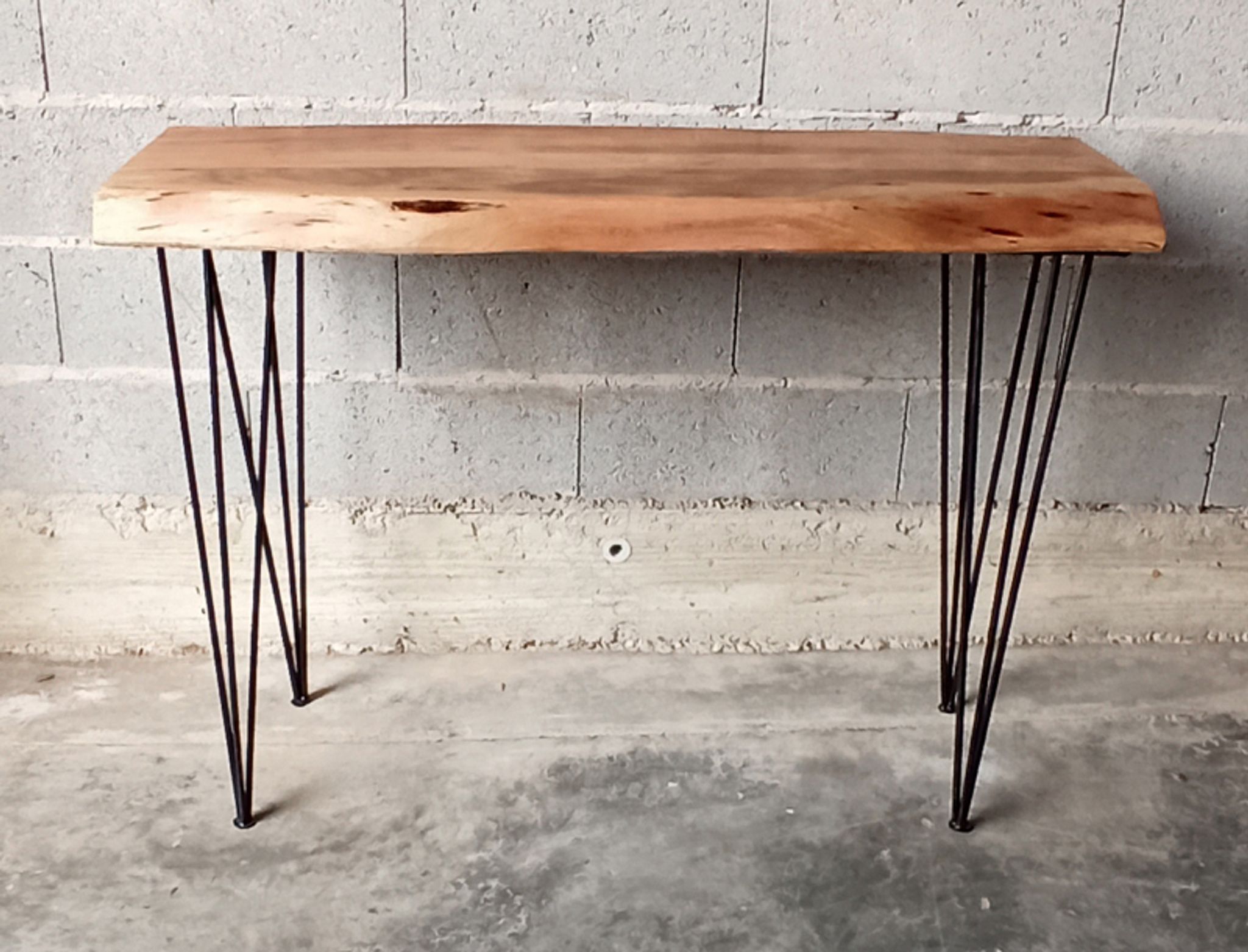 Wooden console with metal feet