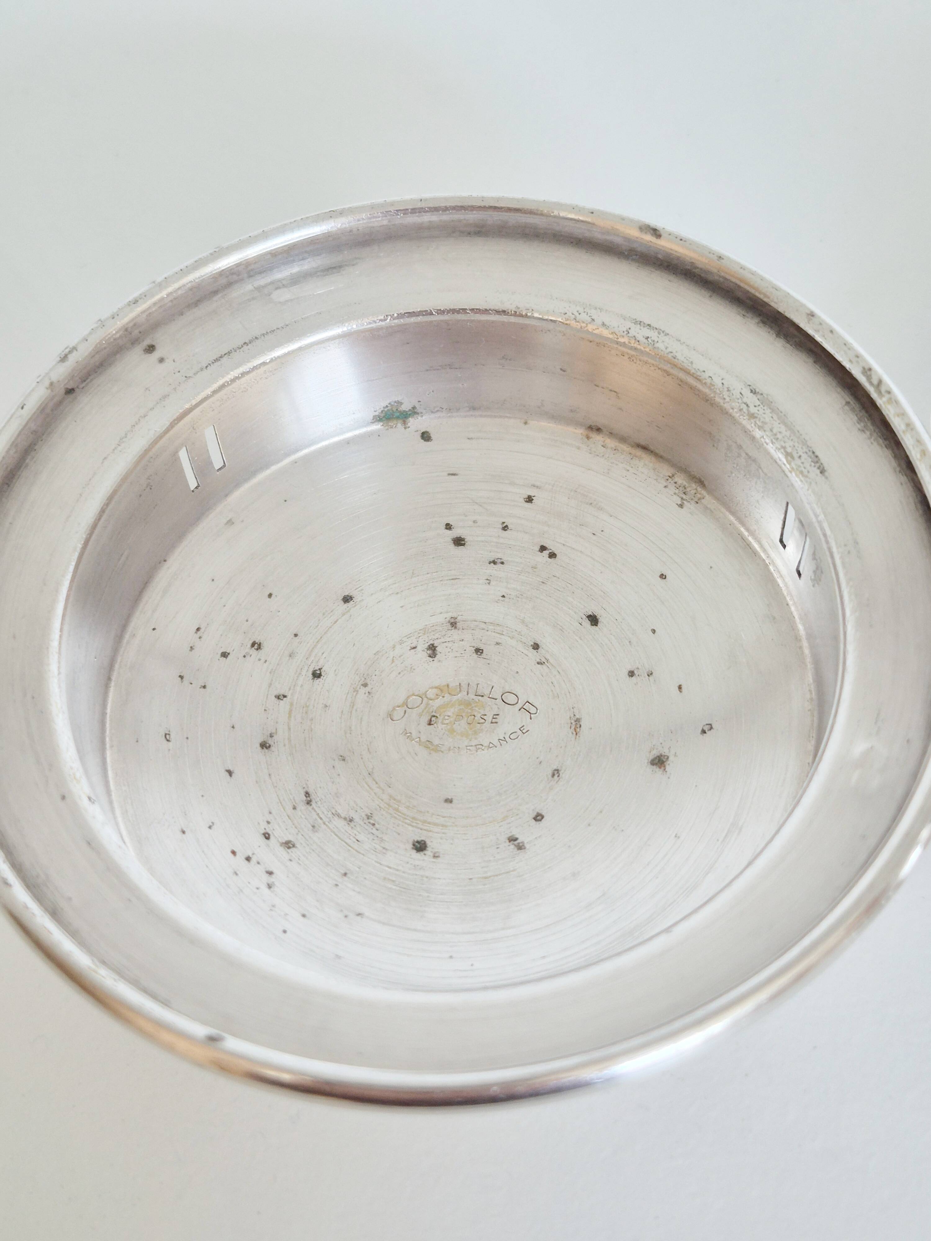 Silver scallop shell butter dish.
