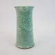 Large green ceramic pitcher with leopard enamel