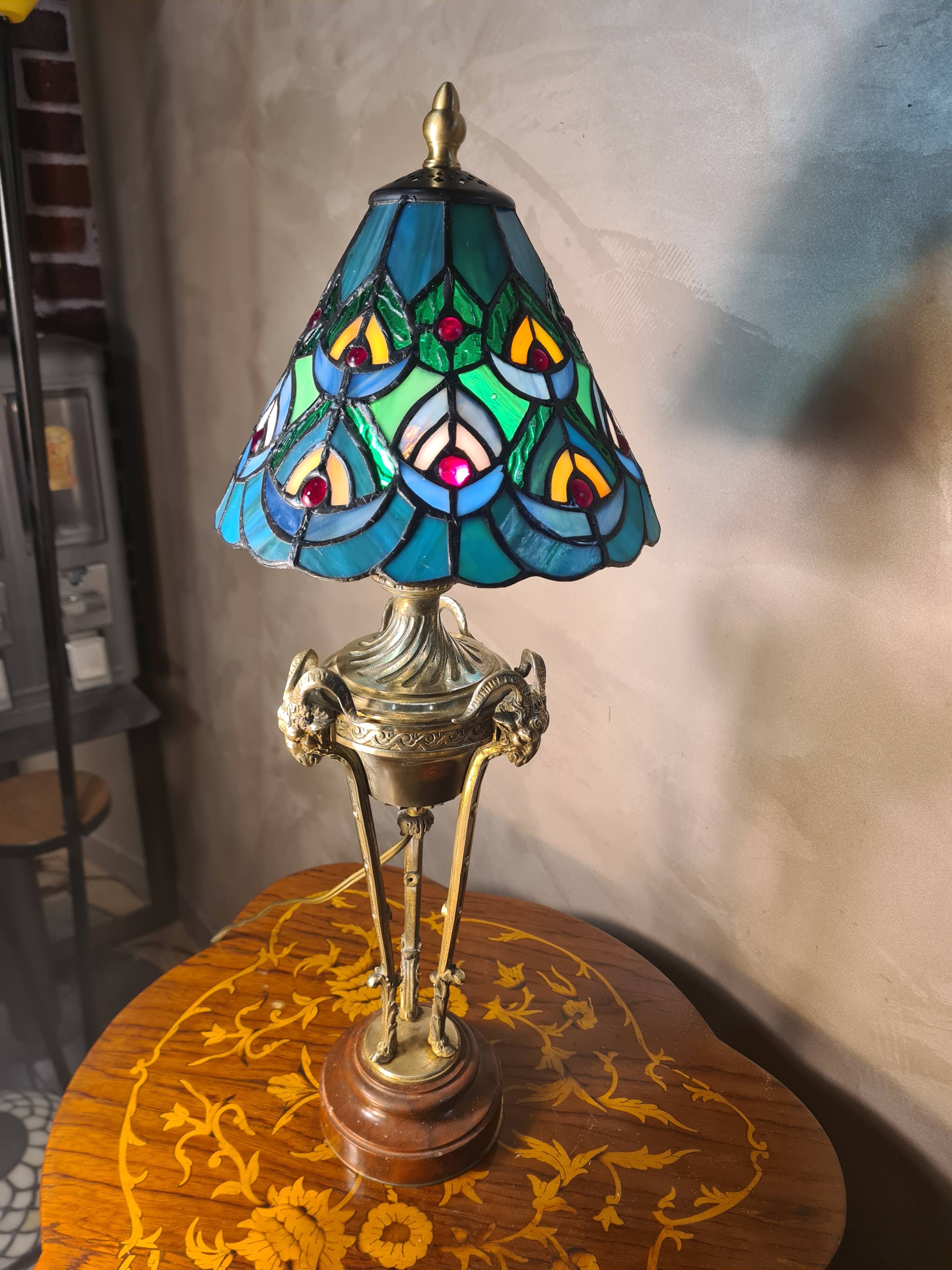 bronze lamp with a goat's head from the 19th century and a stained glass lampshade soldered with lead