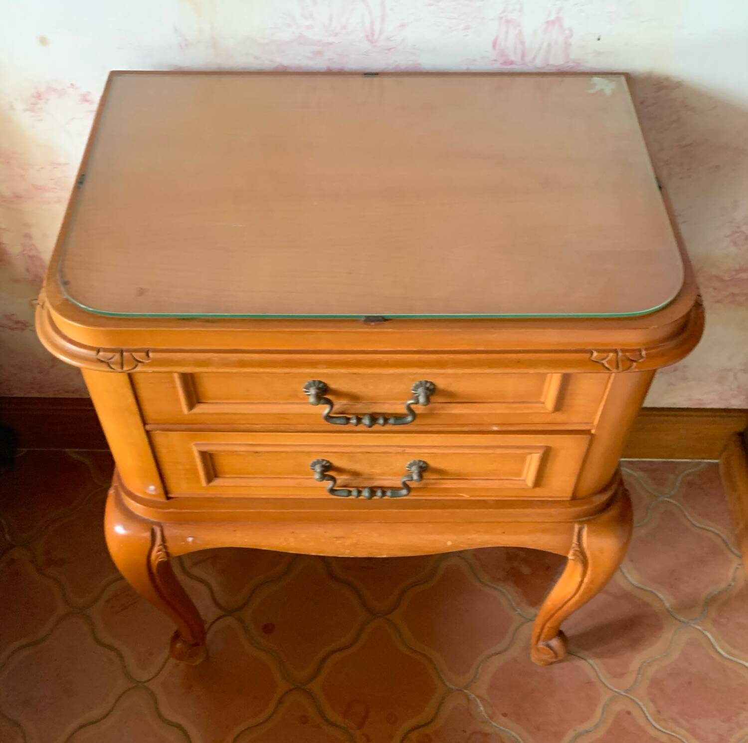 Classic carved cherry bedside table with glass top