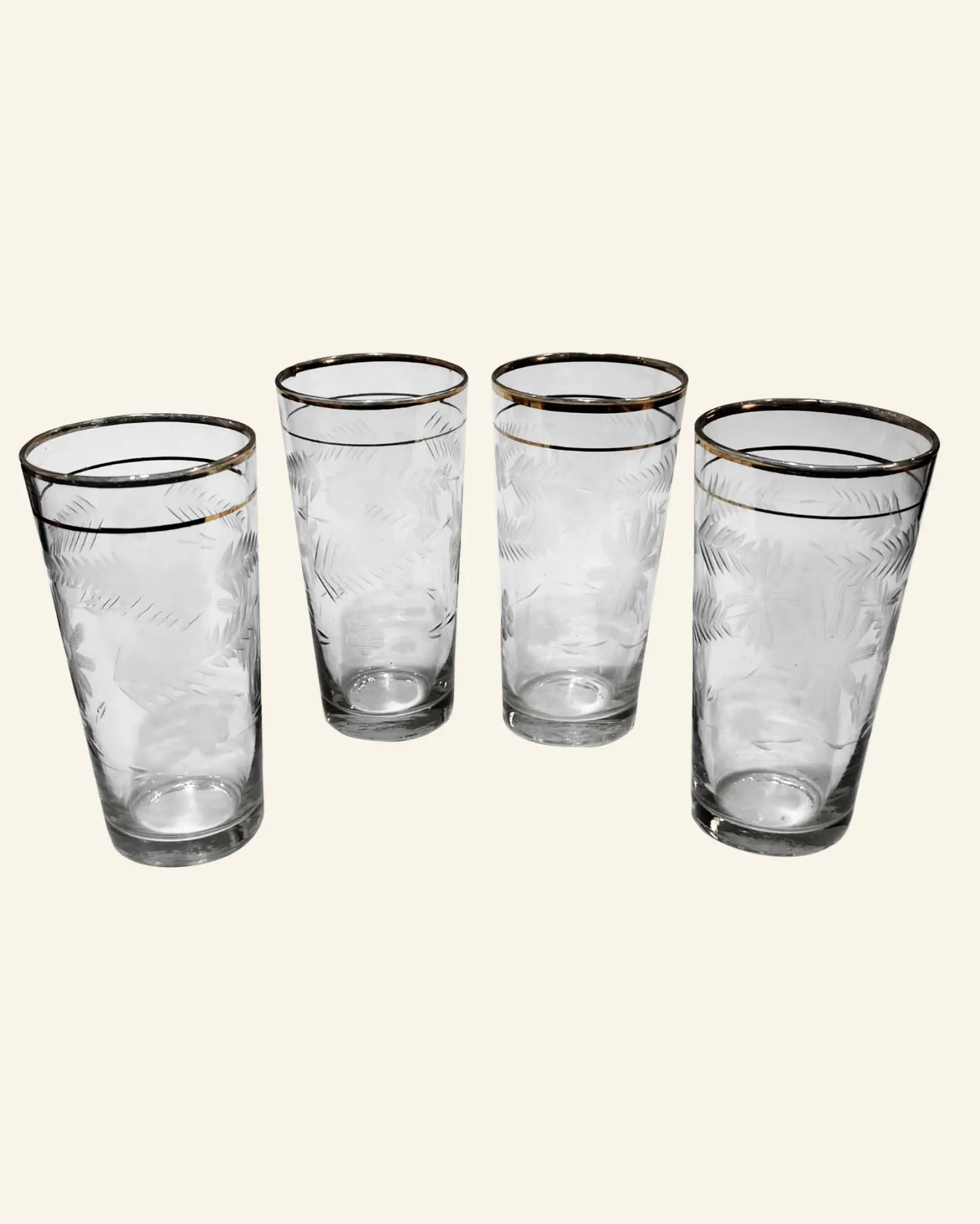 Four engraved crystal glasses from La Granja, with gilded edges, early 20th century.