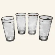 Four engraved crystal glasses from La Granja, with gilded edges, early 20th century.