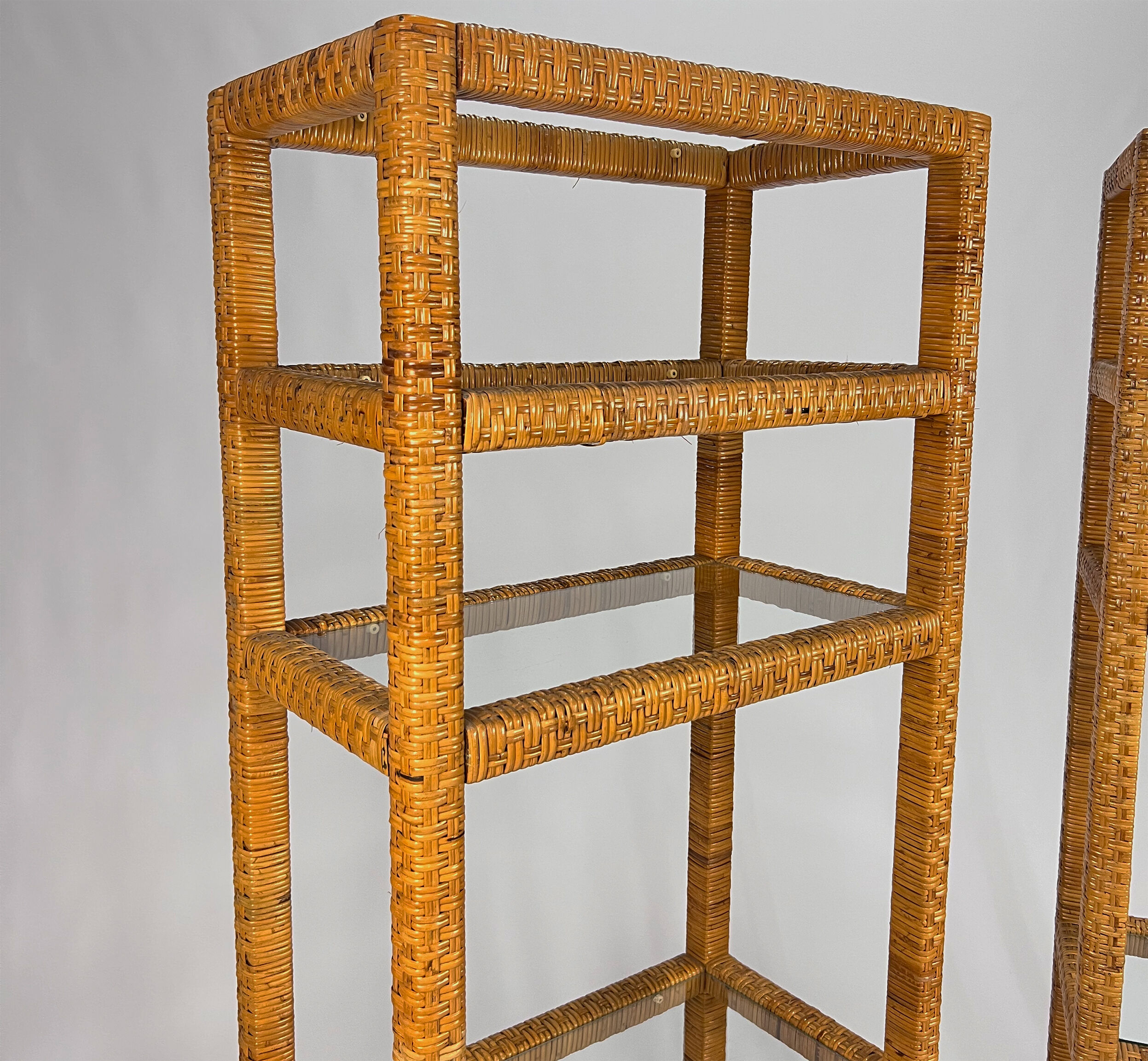 Set of 2 mid century tall wicker and glass etagere cabinet, 1970s