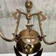 Art Nouveau chandelier with three arms and opalescent iridescent glass.