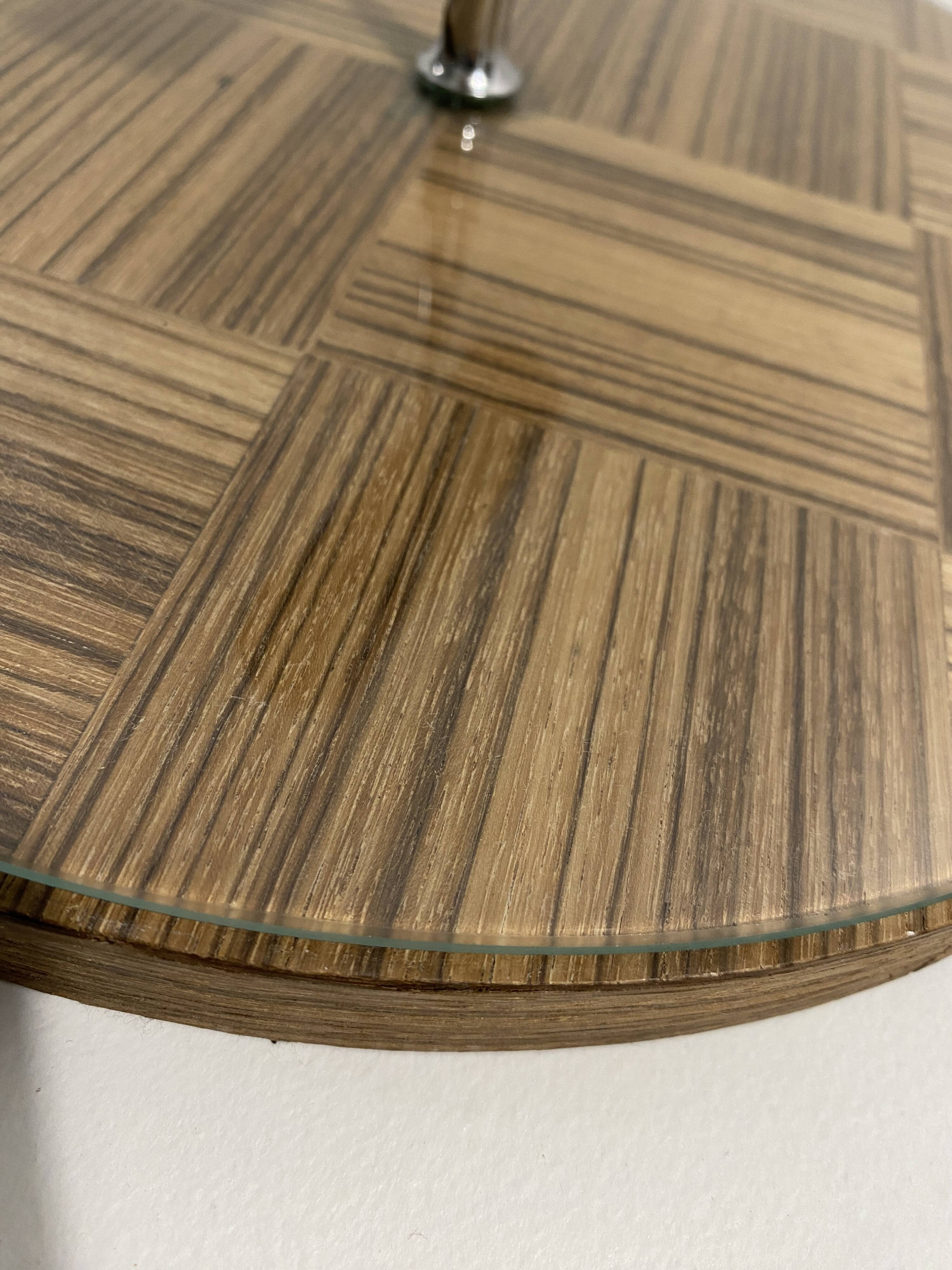 Vintage round wooden cheese board covered with glass plate with foldable handle