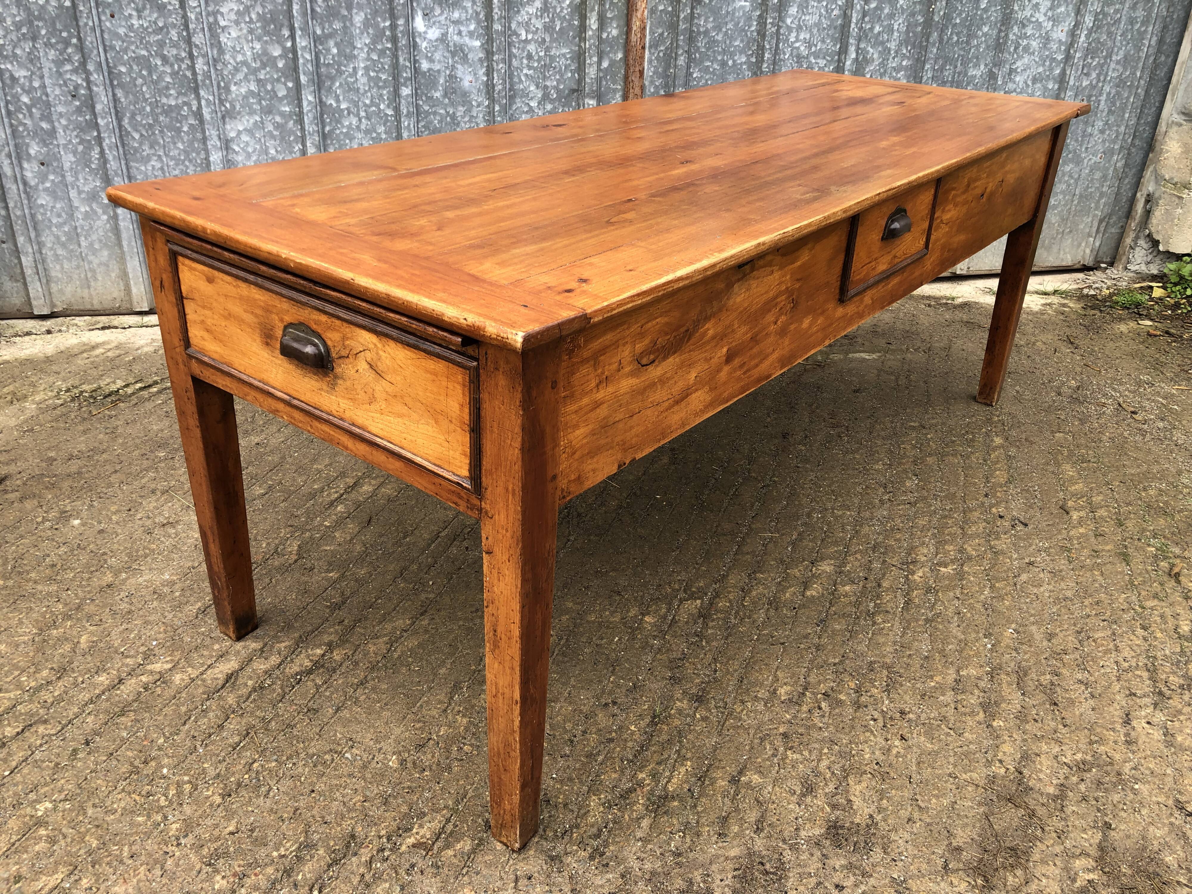 Antique farmhouse table in solid cherry wood with 3 drawers and 1 pull-out.