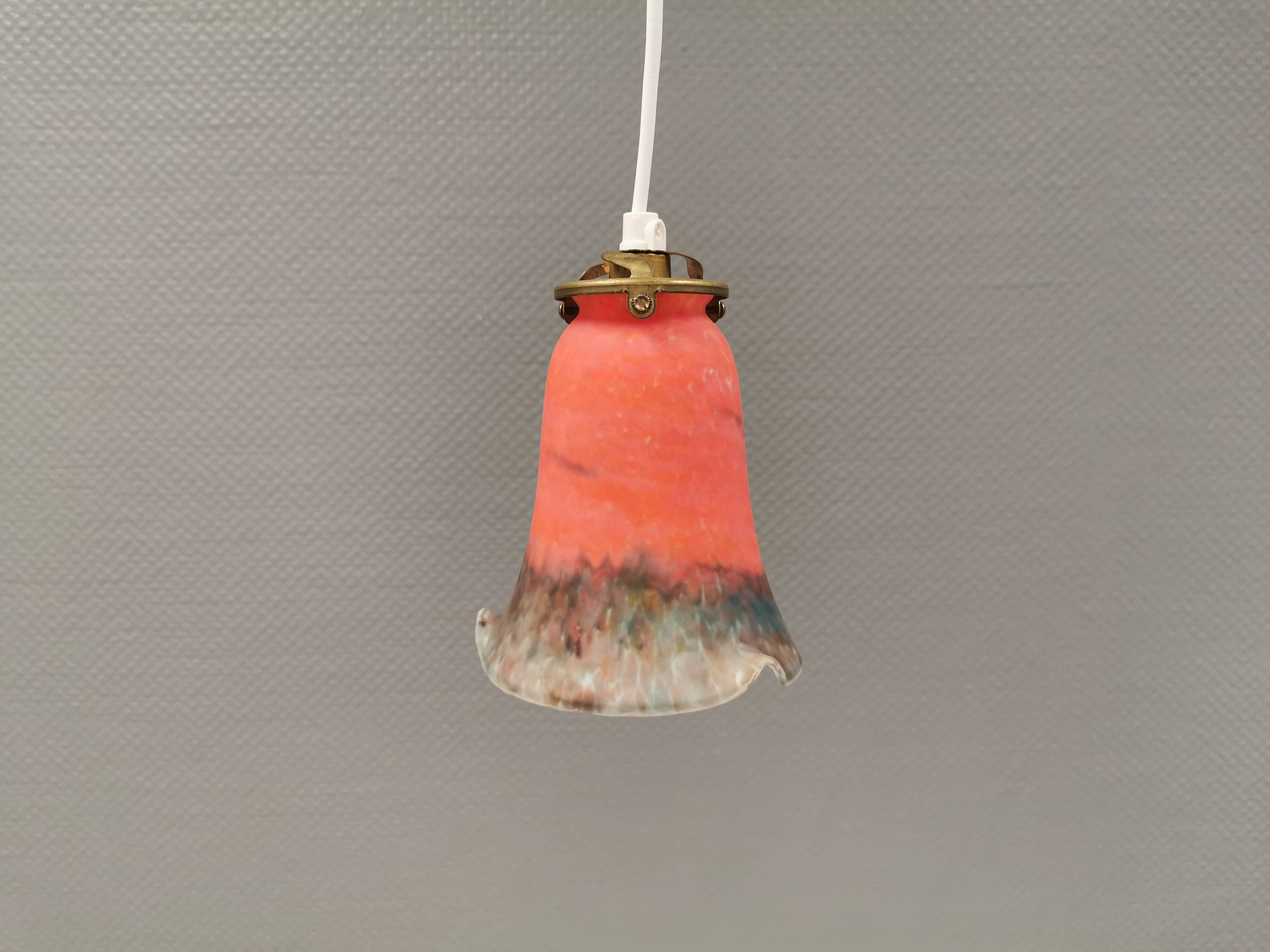Small, beautiful hanging lamp in Art Deco style with brass top.