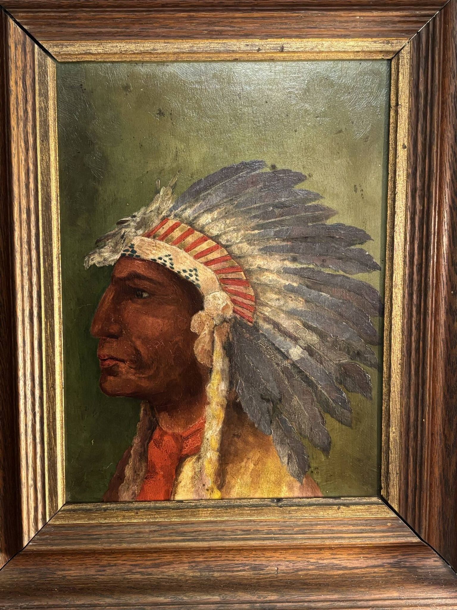 Old oil painting on panel of a Native American chief from the 19th century Wild West.