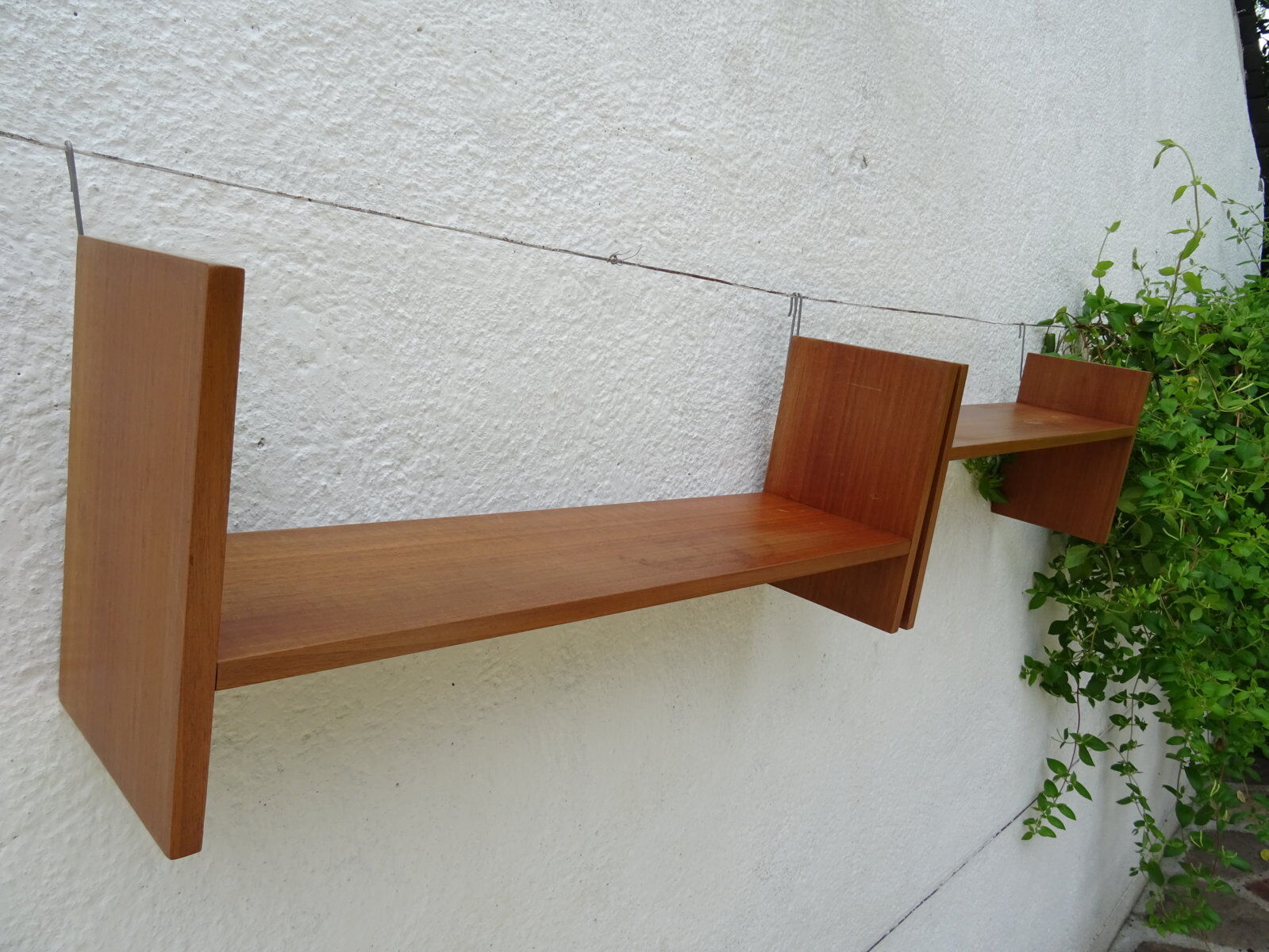 Pair of teak wall shelves