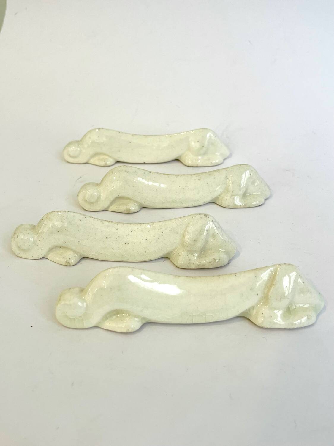 Set of 4 Art Deco knife rests, Primavera workshop