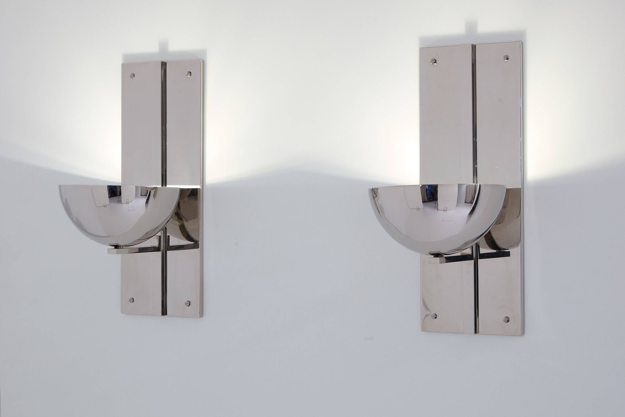Pair of modernist wall lights by Claude Parent, nickel-plated steel, 1992.