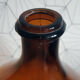Great old demijohn in amber glass