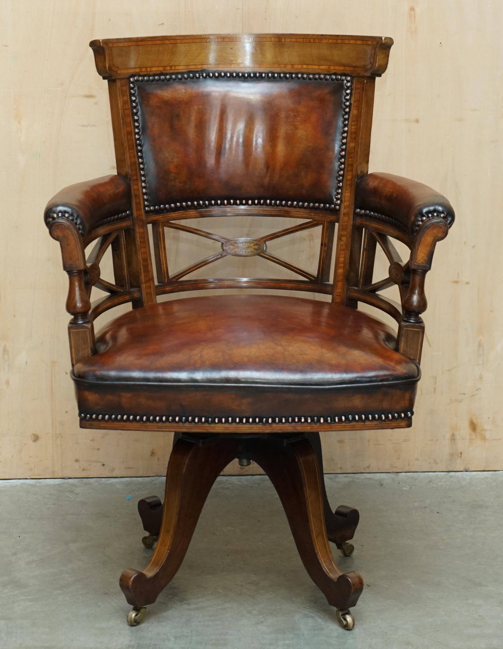 Victorian captain's chair in leather restored by Cornelius V Smith.