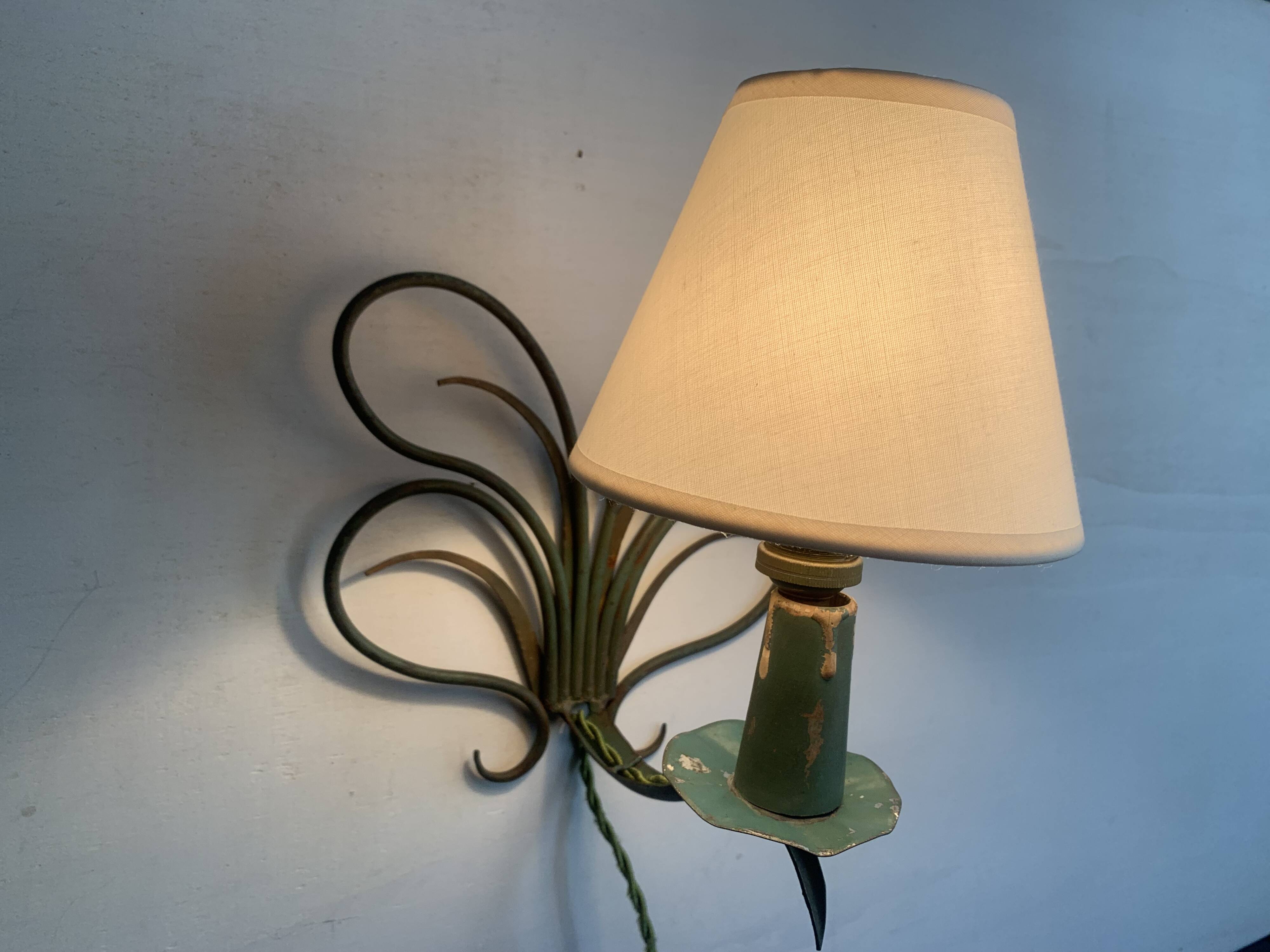 Pair of wall lights in patinated green painted iron, 1950s