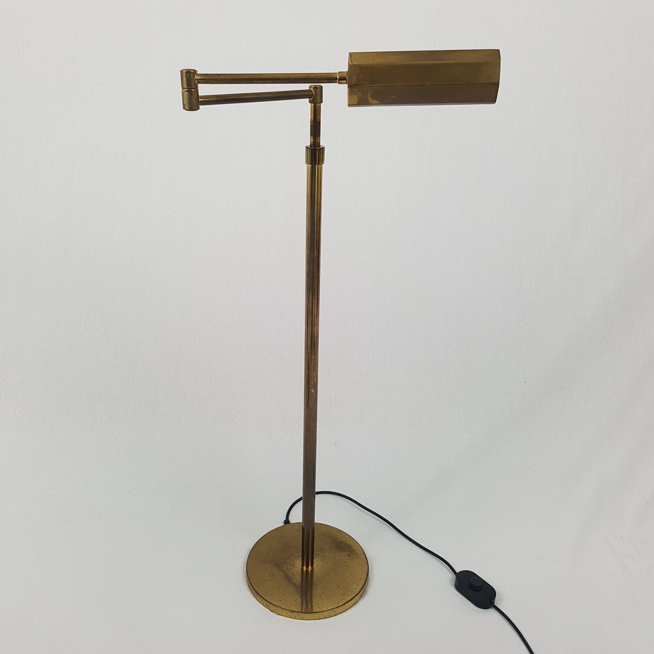 Articulated brass floor lamp