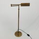 Articulated brass floor lamp