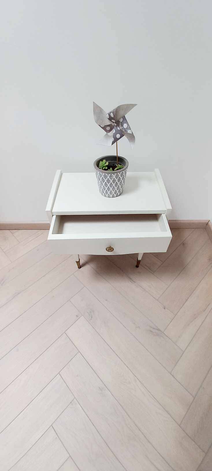 Vintage bedside table with compass foot