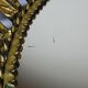 Large Italian sunburst wall mirror in gilded metal, 1960s-70s.