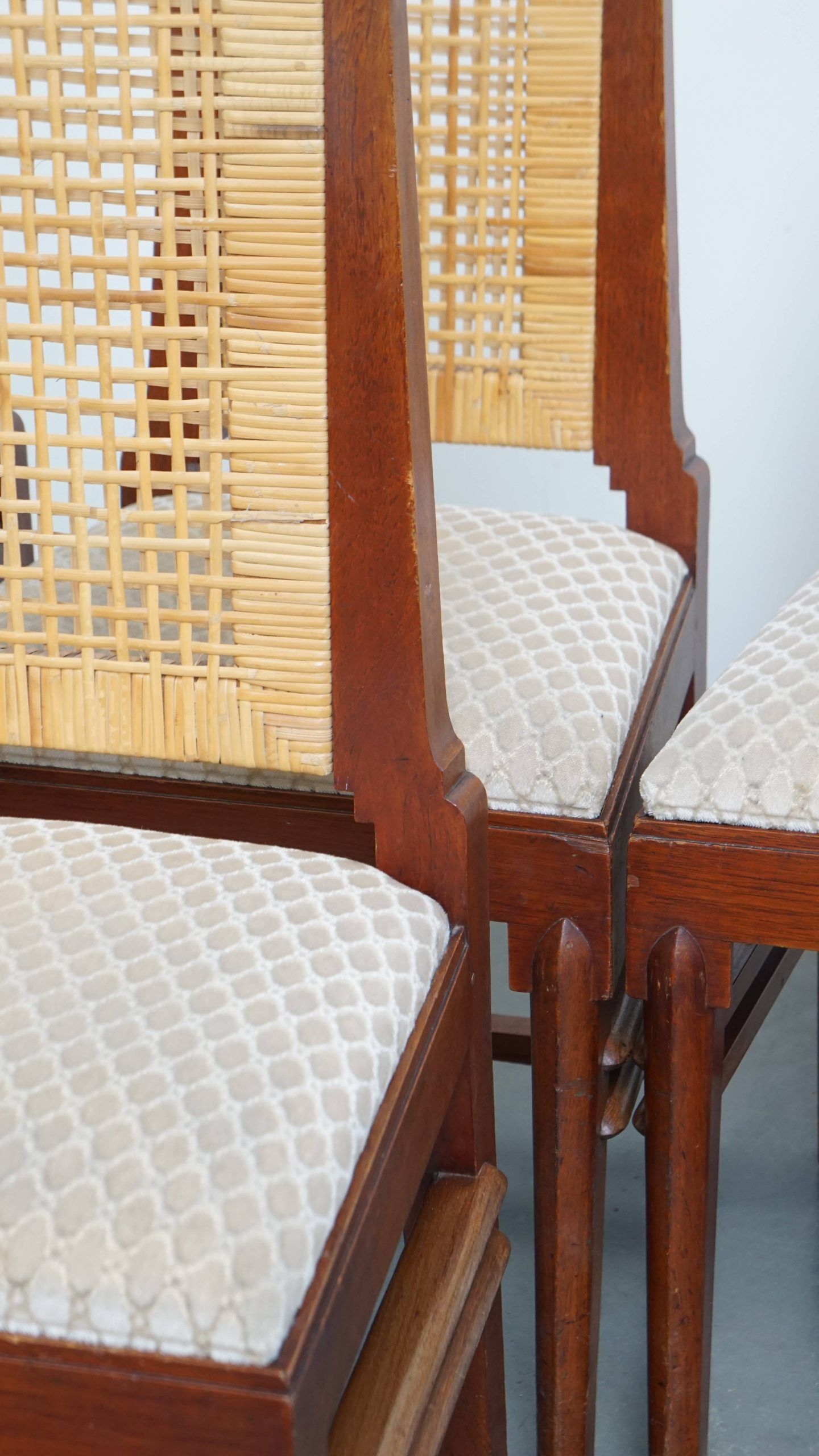 4 wooden Art Deco design dining chairs with a wicker seat and backrest