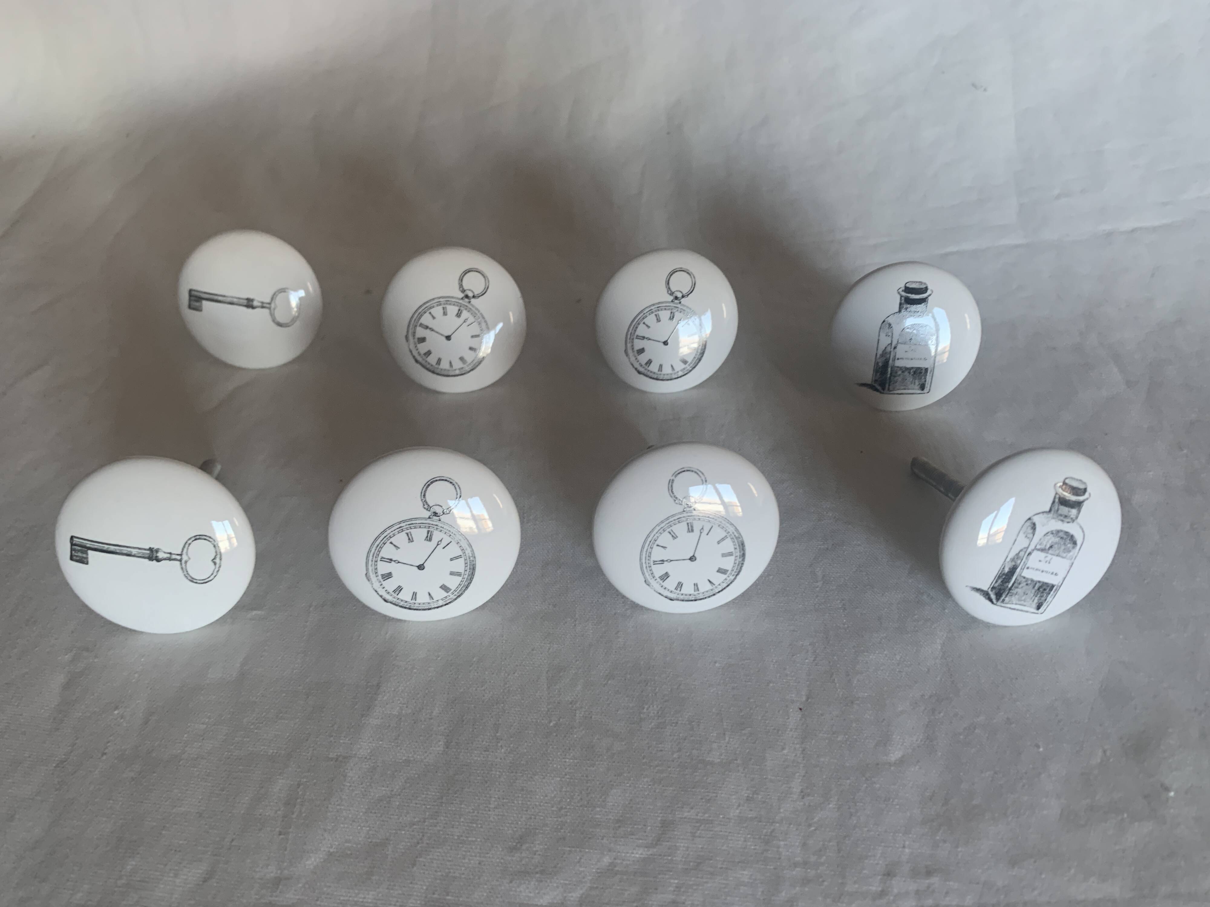 white ceramic door knobs with illustration