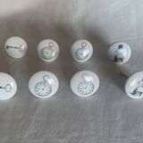 white ceramic door knobs with illustration