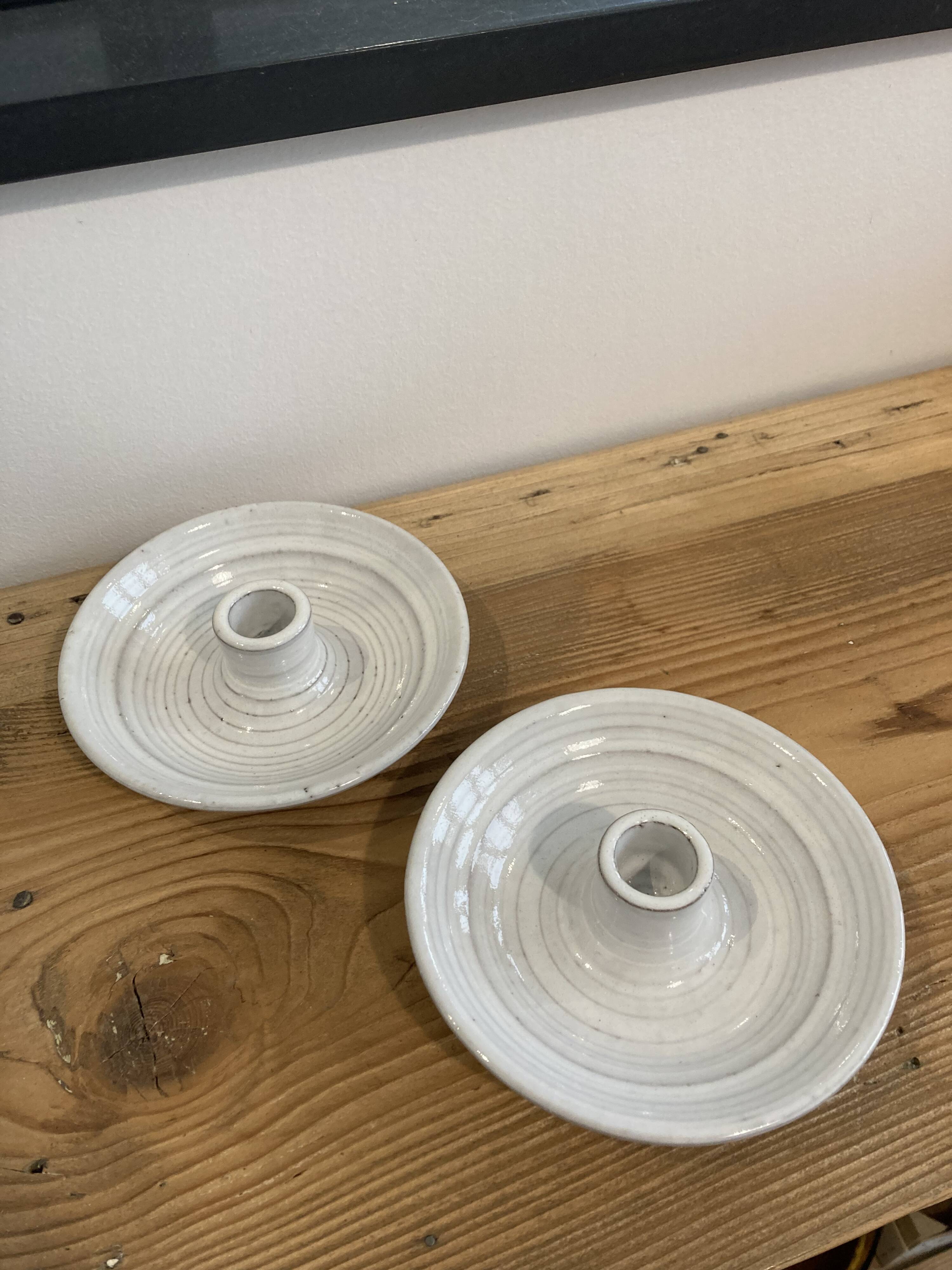 Pair of enamelled ceramic candlesticks