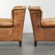 Set of two light cowhide wingback armchairs with a timeless English look