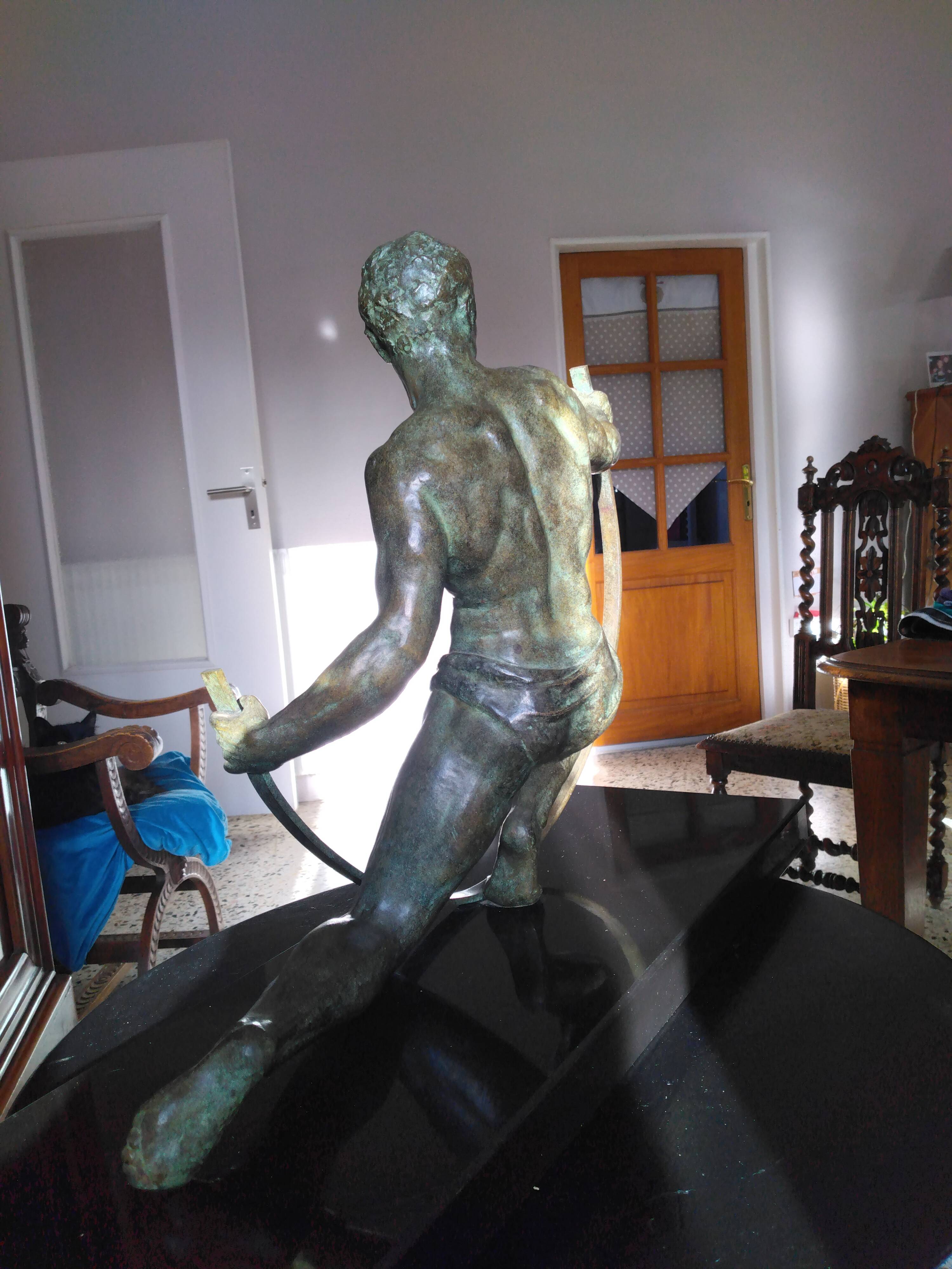 bronze sculpture athlete bending an iron bar by Jean de Roncourt on an art deco marble base