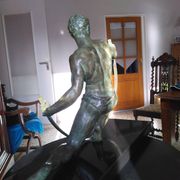 bronze sculpture athlete bending an iron bar by Jean de Roncourt on an art deco marble base
