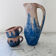 Set of artisanal pitcher and weathered cups