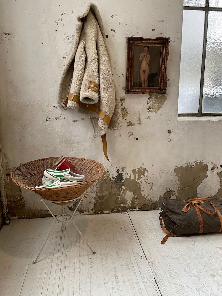 Wicker garden basket on tripod support