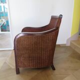 Vintage colonial-style armchair in woven rattan and exotic wood