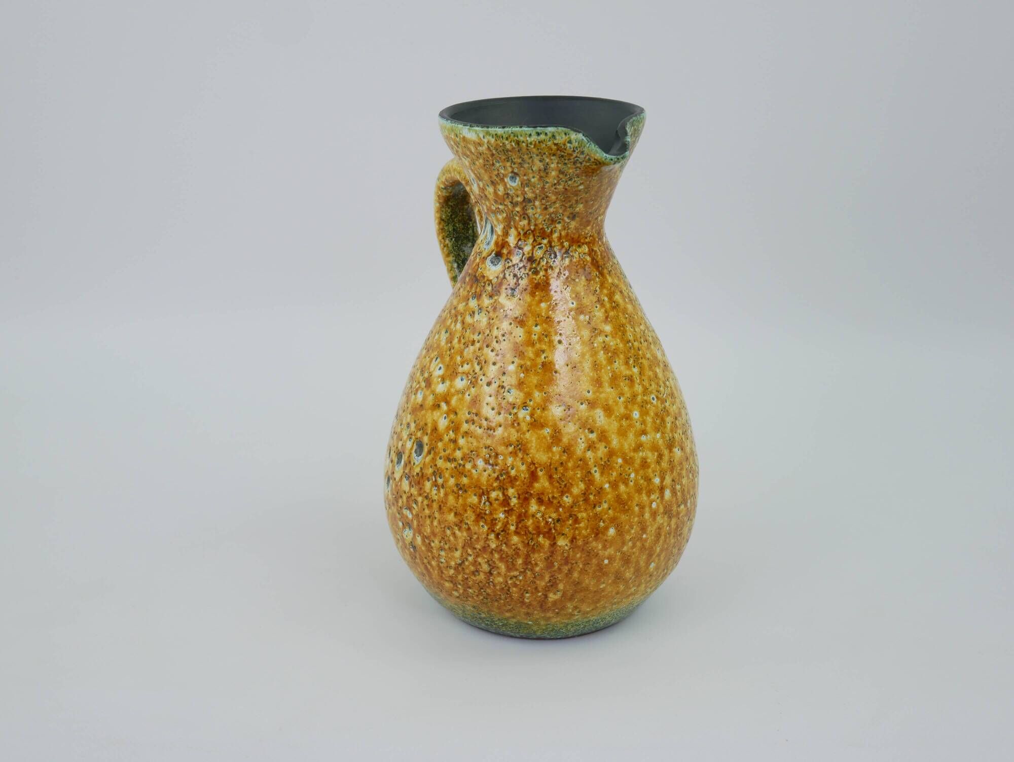 Large yellow ceramic pitcher in the Accolay style