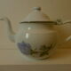 Teapot or coffee maker in old enamelled sheet metal
