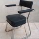 Vintage office chair in chrome metal and faux leather.
