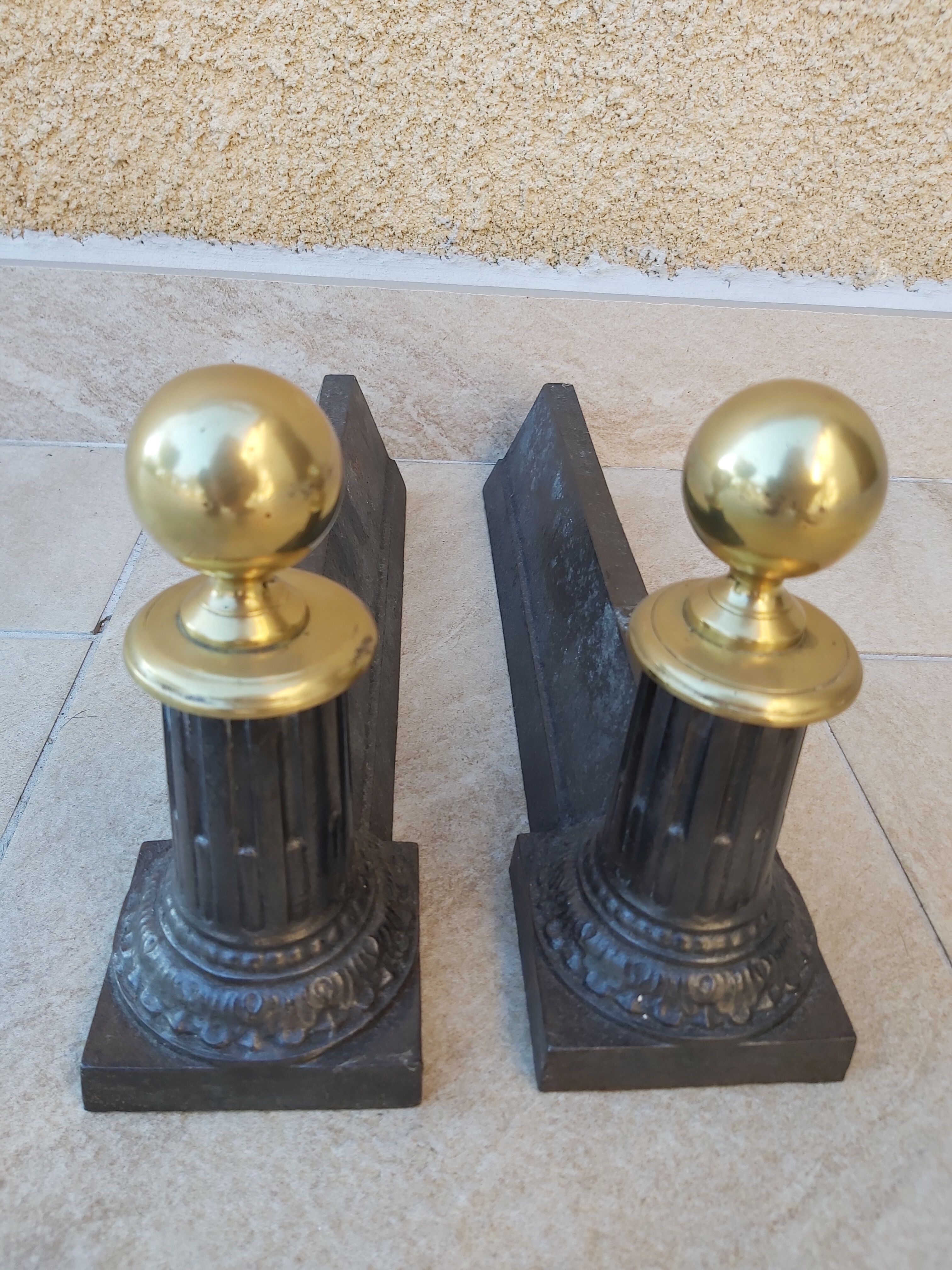 Pair of cast iron and bronze chenets