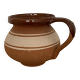 Hungarian folk ceramic pitcher in glossy brown and beige, traditional rounded pot.