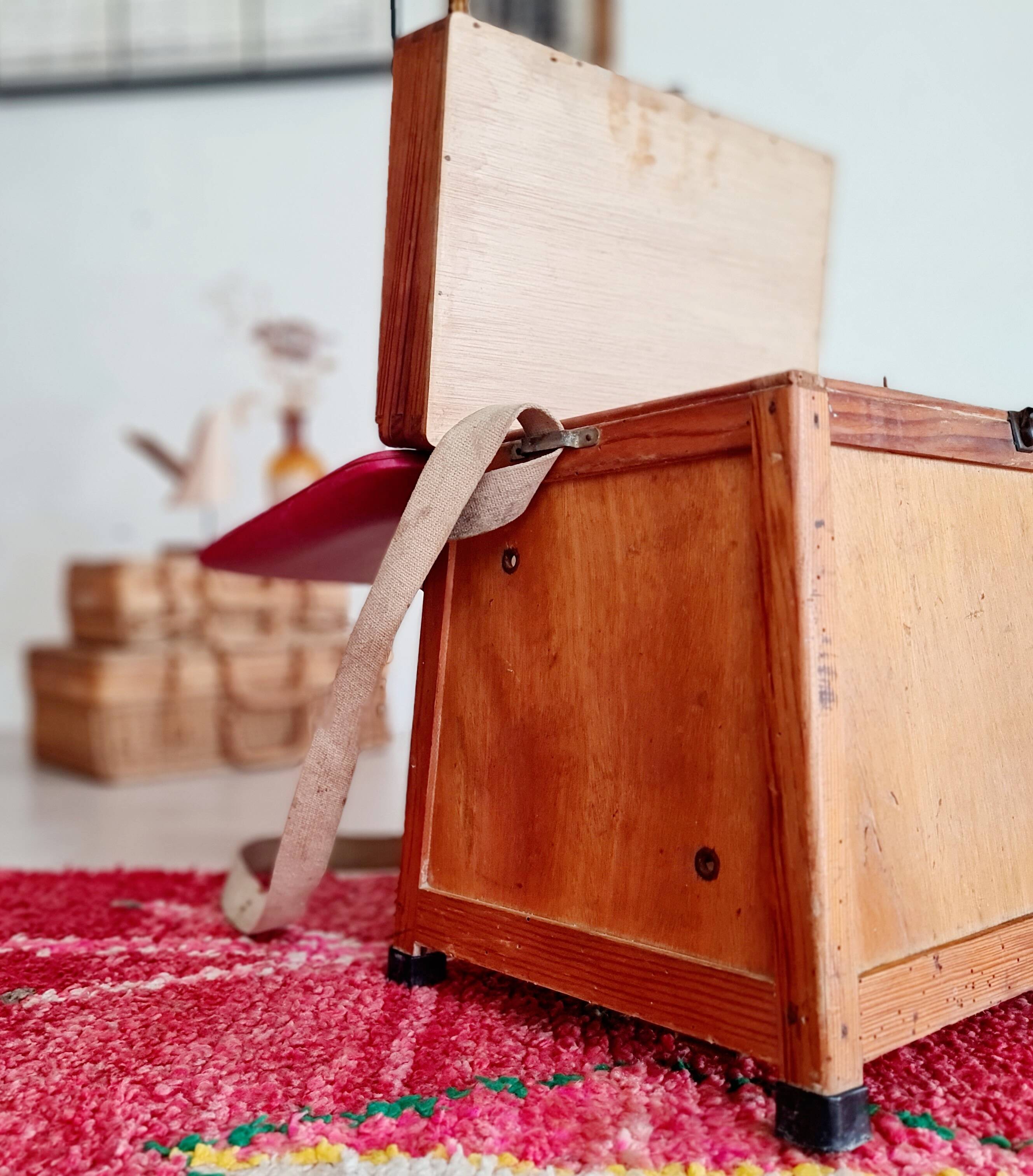 Old fisherman's stool with red seat