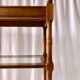 Classic wooden shelves, glass tops and cannage