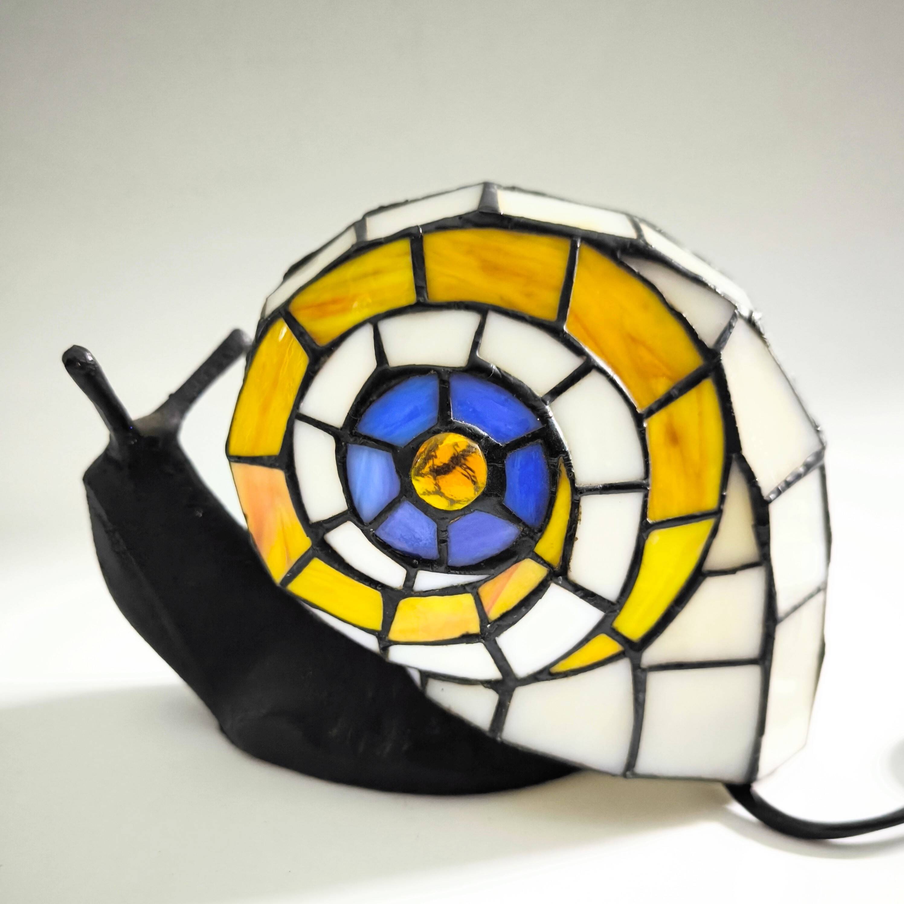 Tiffany-style lamp in the shape of a snail.