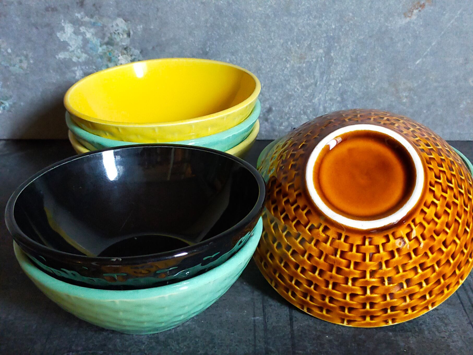 Seven vintage slip ceramic bowls