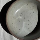 A speckled grey interior bowl with a matte brown exterior H5 D15