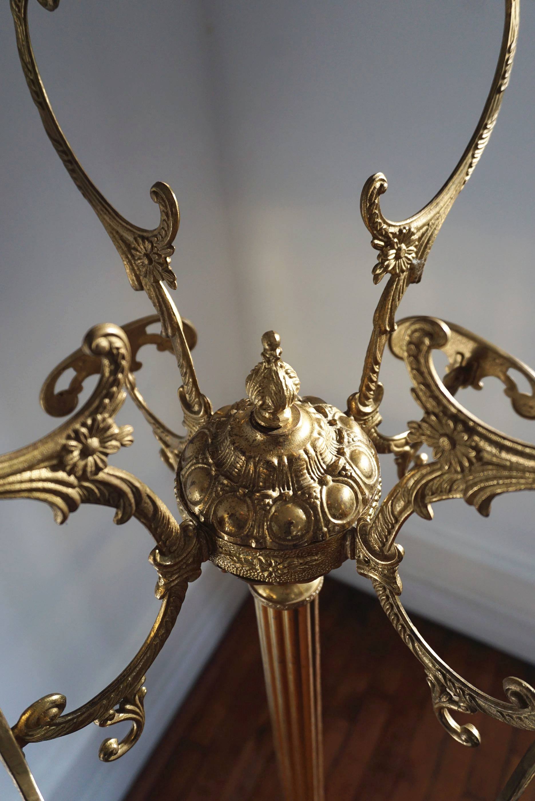 Turning brass coat rack