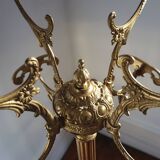 Turning brass coat rack